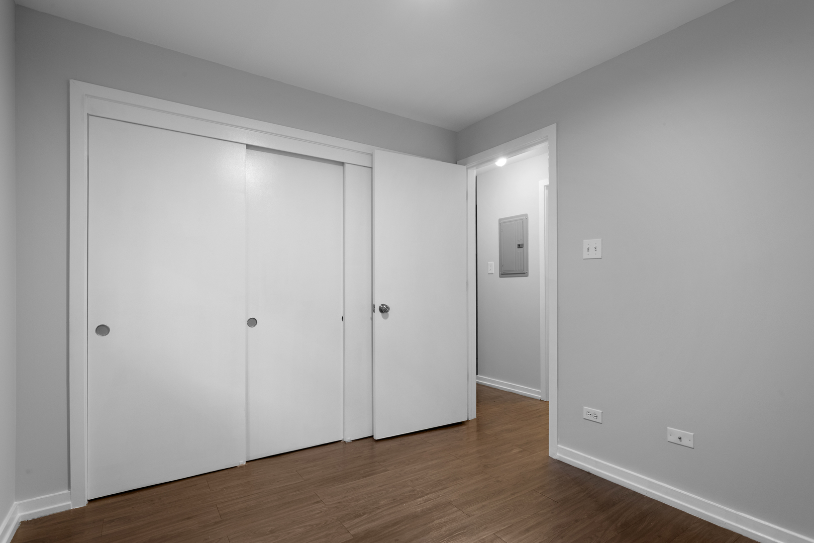 5411 North Winthrop Avenue, Unit 513 Chicago, IL 60640 - Photo 7 of 14 a view of an empty room with wooden floor