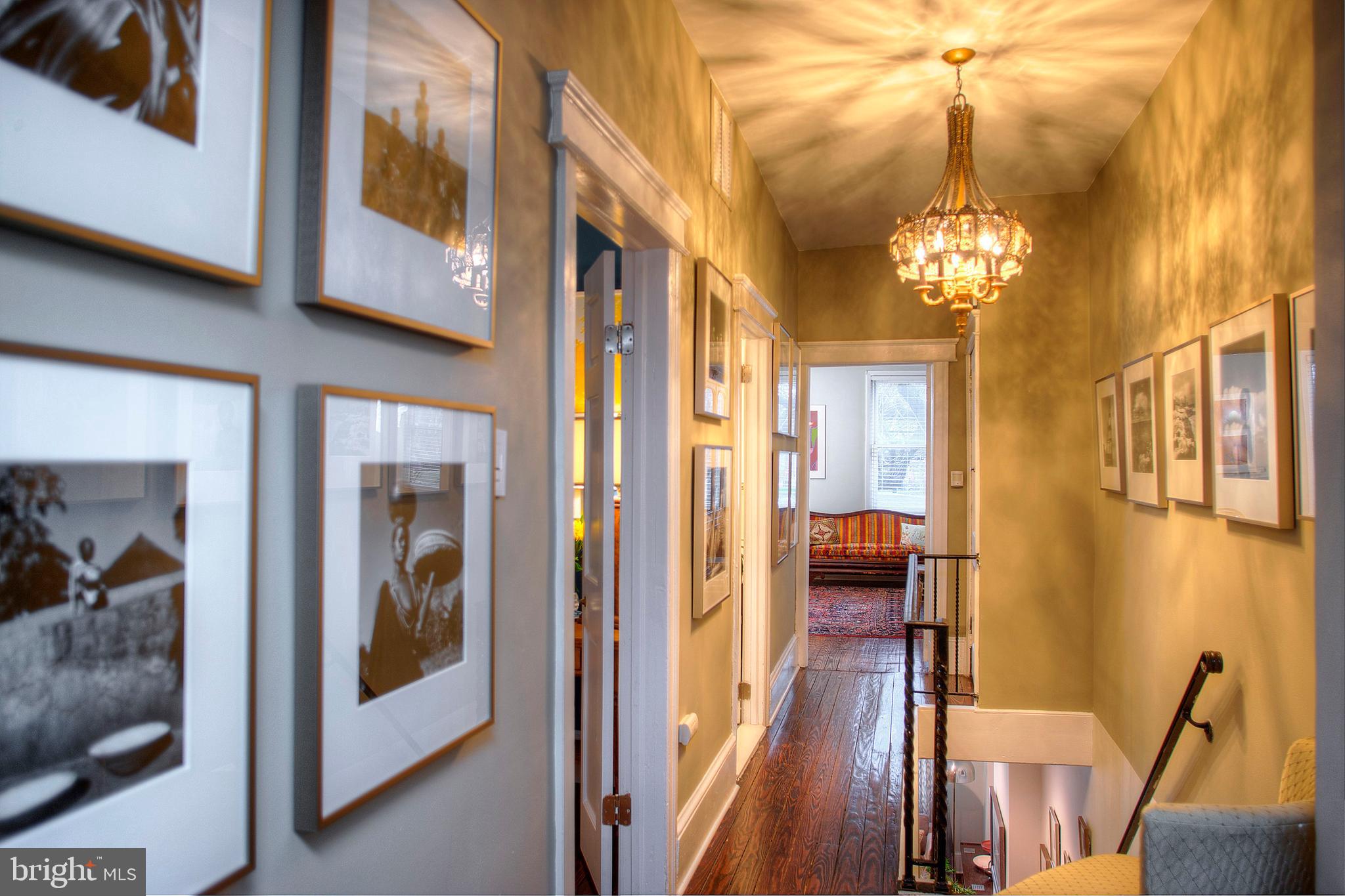 1615 East Moyamensing Avenue Philadelphia, PA 19148 - Photo 11 of 17 a view of a hallway with furniture and chandelier