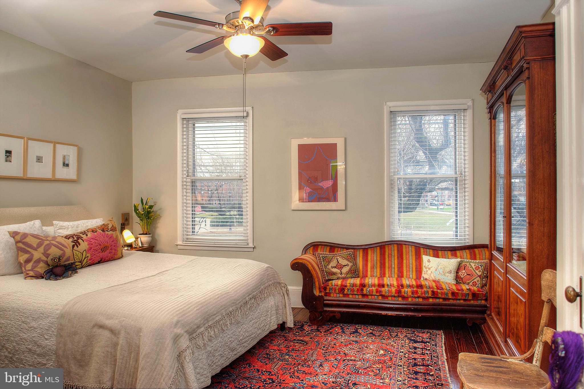 1615 East Moyamensing Avenue Philadelphia, PA 19148 - Photo 12 of 17 a bedroom with a bed and wooden floor