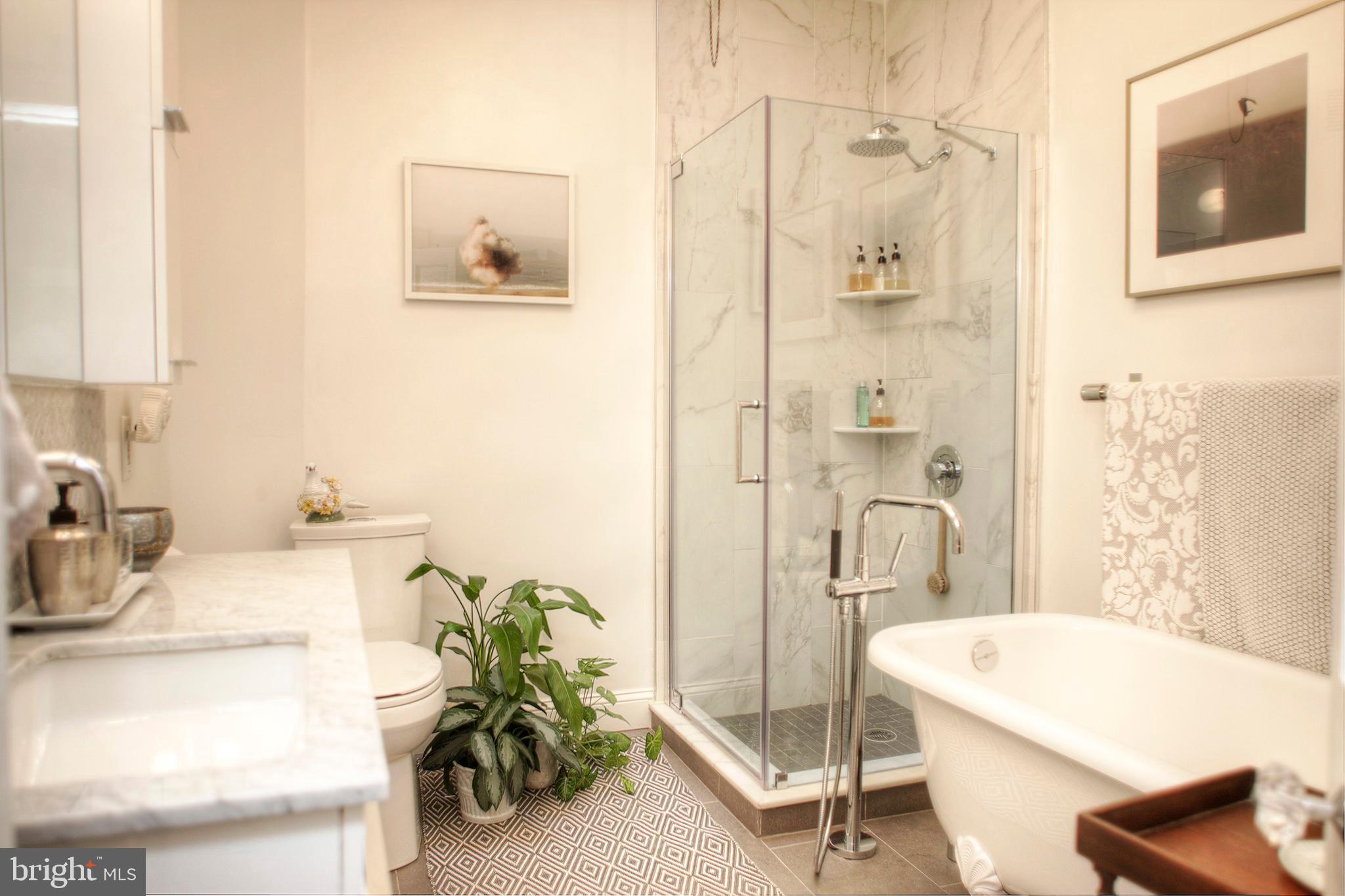 1615 East Moyamensing Avenue Philadelphia, PA 19148 - Photo 13 of 17 a bathroom with a tub sink and mirror