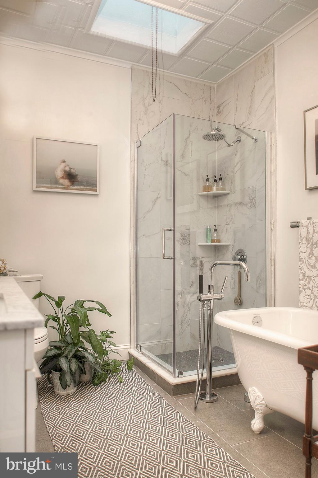 1615 East Moyamensing Avenue Philadelphia, PA 19148 - Photo 14 of 17 a bathroom with a bathtub and a shower