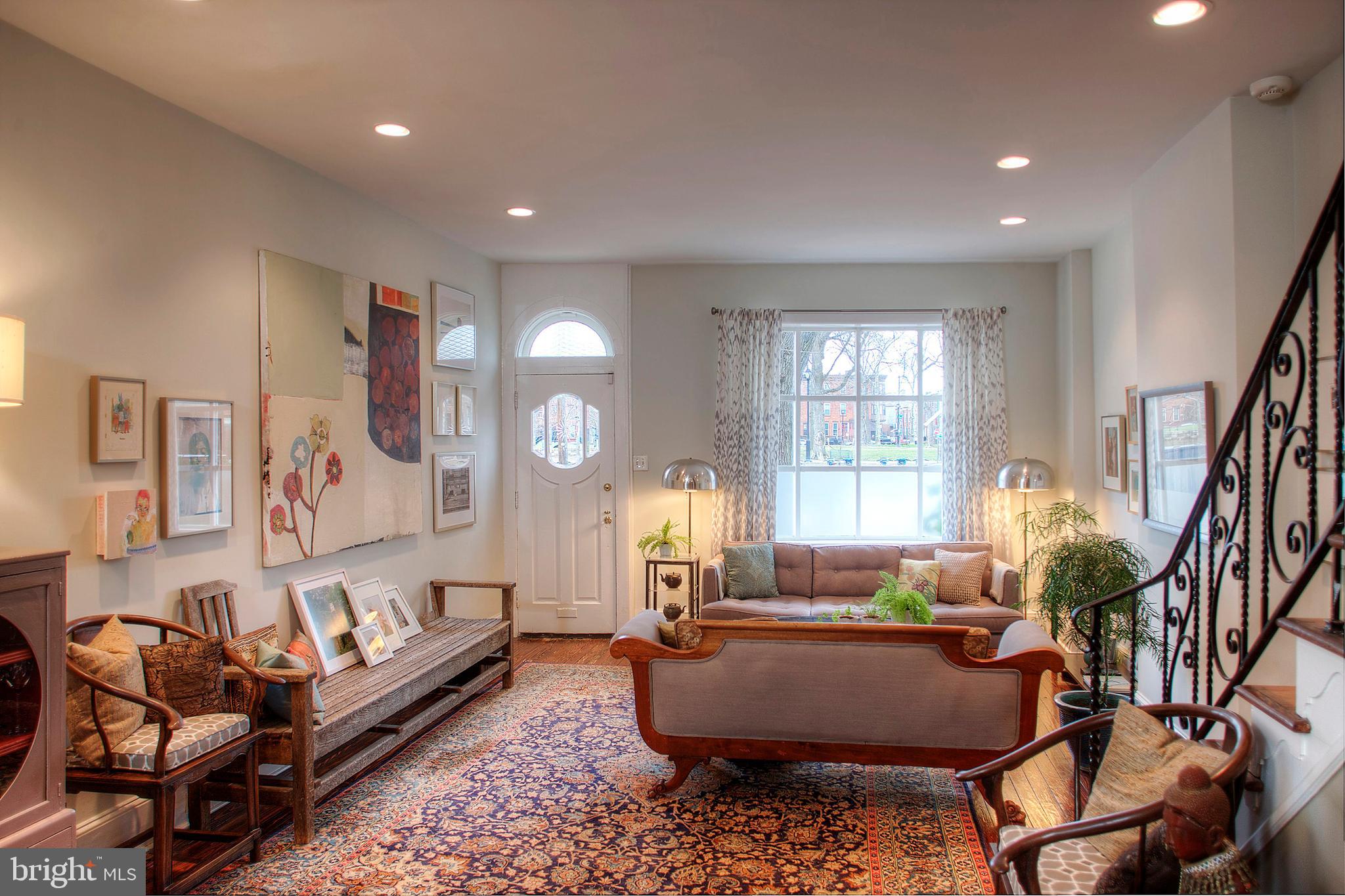 1615 East Moyamensing Avenue Philadelphia, PA 19148 - Photo 5 of 17 a living room with furniture and a large window