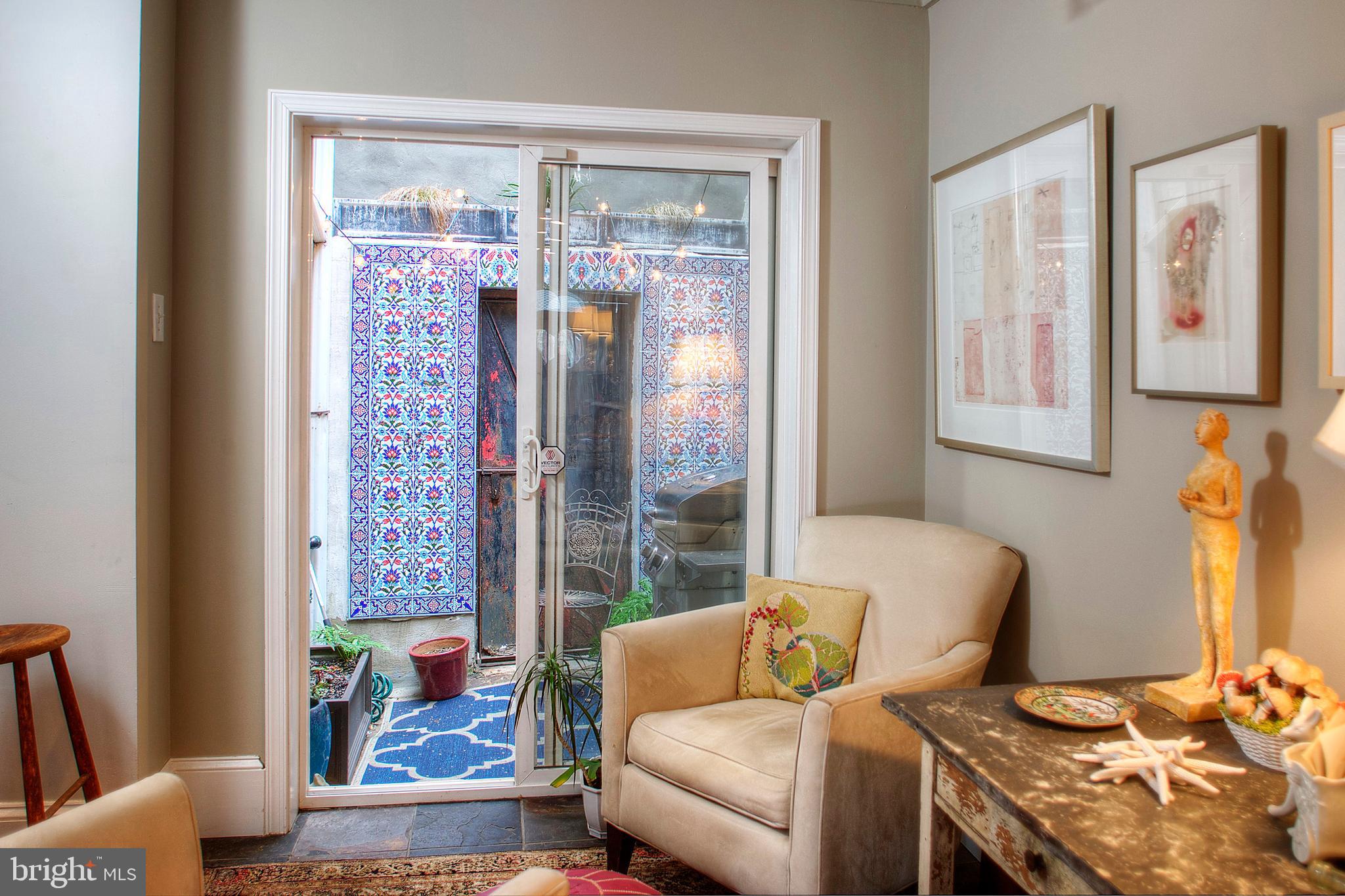 1615 East Moyamensing Avenue Philadelphia, PA 19148 - Photo 8 of 17 a living room with furniture and a window
