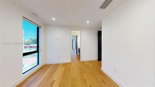 a bathroom with a double vanity sink and mirror