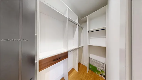 a bathroom with a glass shower door and a toilet