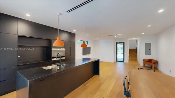 a lobby with furniture and mirror