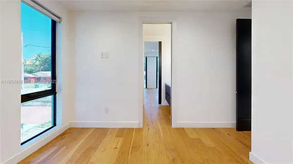 a bathroom with a granite countertop sink and mirror