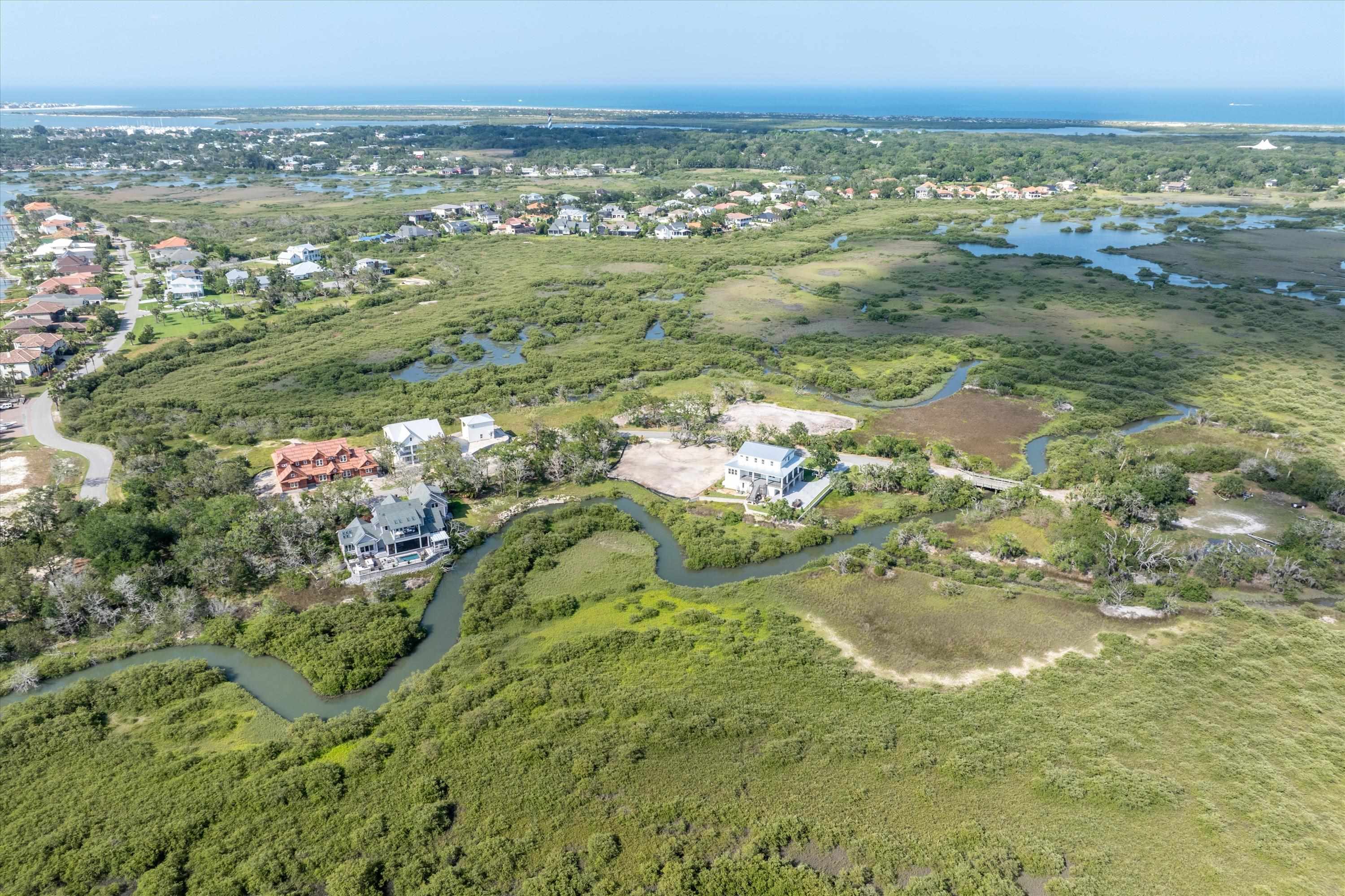 Reef Drive St. Augustine, FL 32080 - Photo 2 of 7 a view of a lake view and mountain with trees