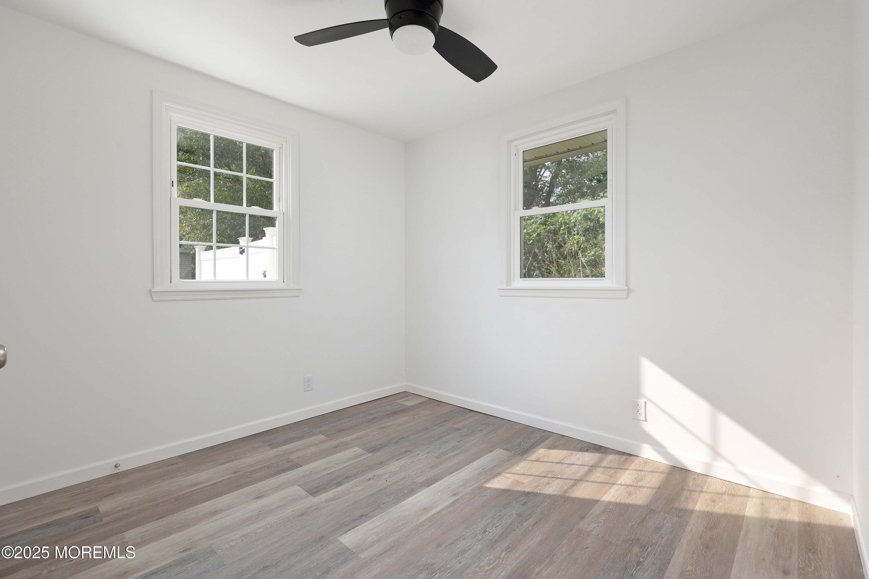 914 Pemberton Browns Mills Road Pemberton, NJ 08068 - Photo 13 of 28 a view of empty room with wooden floor and window