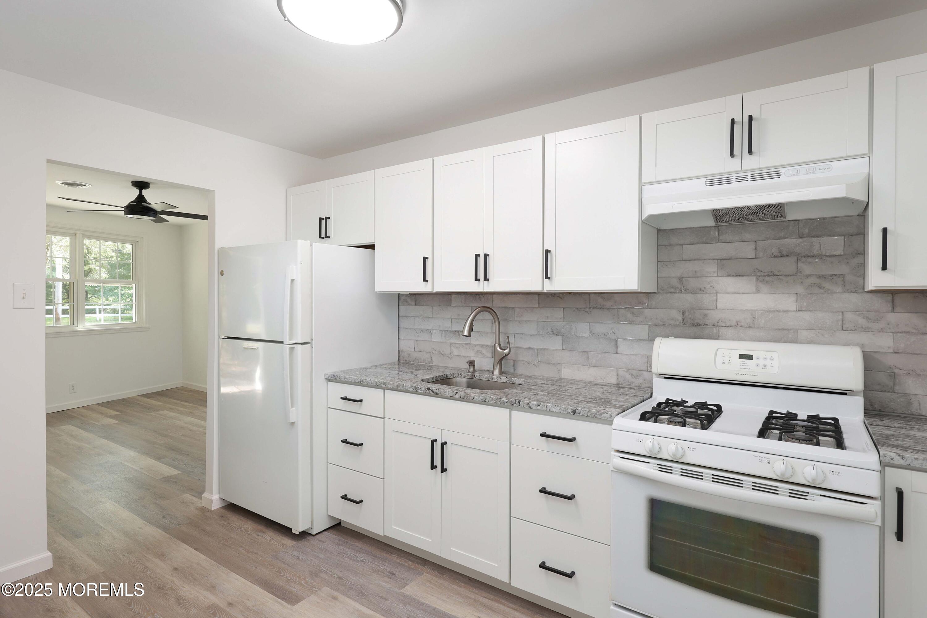 914 Pemberton Browns Mills Road Pemberton, NJ 08068 - Photo 10 of 28 a kitchen with cabinets appliances a sink and a counter space