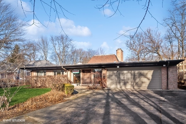 687 Birch Road Glencoe, IL 60022 - Photo 1 of 38 a view of a small yard with large tree