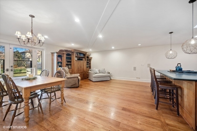 687 Birch Road Glencoe, IL 60022 - Photo 11 of 38 a view of a dining room with furniture window and wooden floor