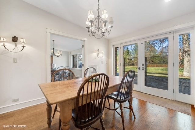 687 Birch Road Glencoe, IL 60022 - Photo 14 of 38 a view of a dining room with furniture window and wooden floor