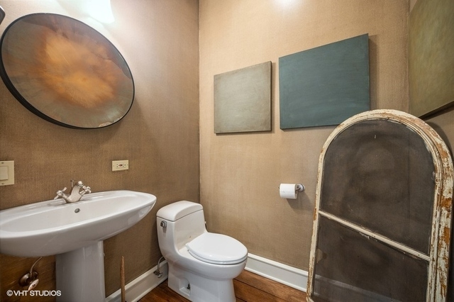 687 Birch Road Glencoe, IL 60022 - Photo 19 of 38 a bathroom with a sink and mirror