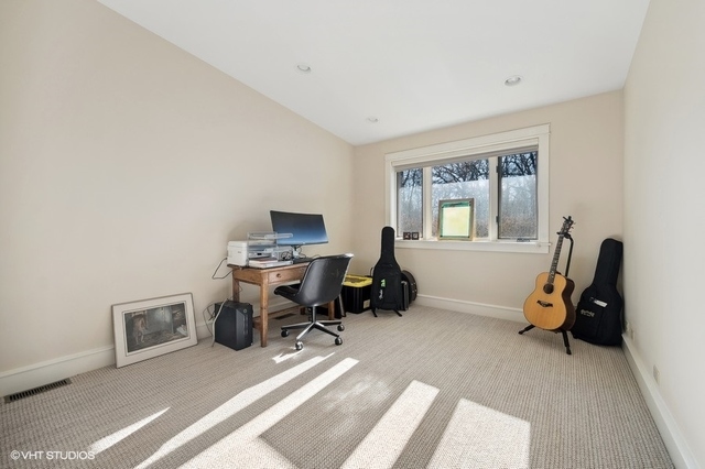 687 Birch Road Glencoe, IL 60022 - Photo 24 of 38 a view of a workspace with furniture and a window