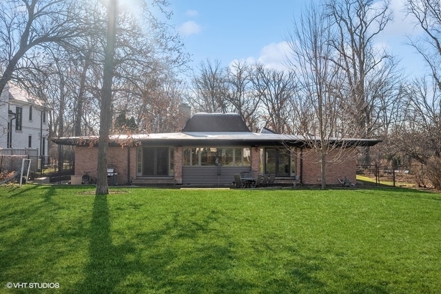 687 Birch Road Glencoe, IL 60022 - Photo 32 of 38 a view of a house with a yard and sitting area