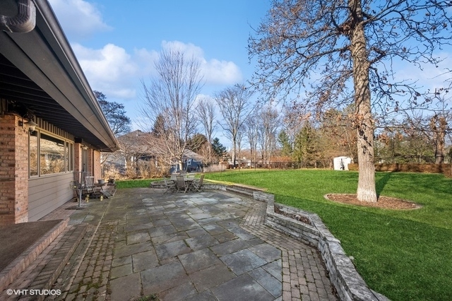 687 Birch Road Glencoe, IL 60022 - Photo 34 of 38 a view of a yard with plants and trees