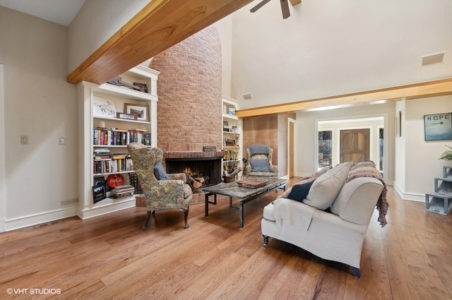 687 Birch Road Glencoe, IL 60022 - Photo 6 of 38 a living room with furniture and a fireplace