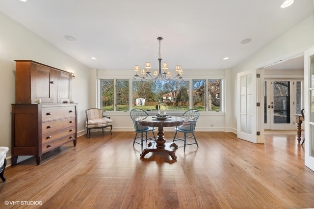 687 Birch Road Glencoe, IL 60022 - Photo 9 of 38 a view of a dining room with furniture and wooden floor