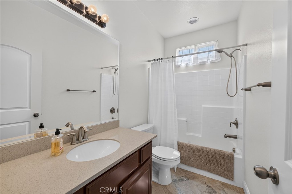 31749 Country View Road Temecula, CA 92591 - Photo 30 of 68 a bathroom with a sink a toilet and shower