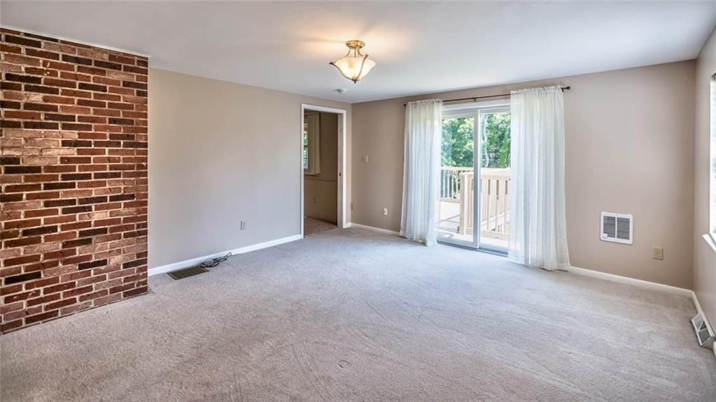 401 Ramsgate Drive Gibsonia, PA 15044 - Photo 10 of 25 First floor master bedroom with slider to deck.