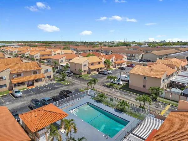 an aerial view of a house with a ocean view