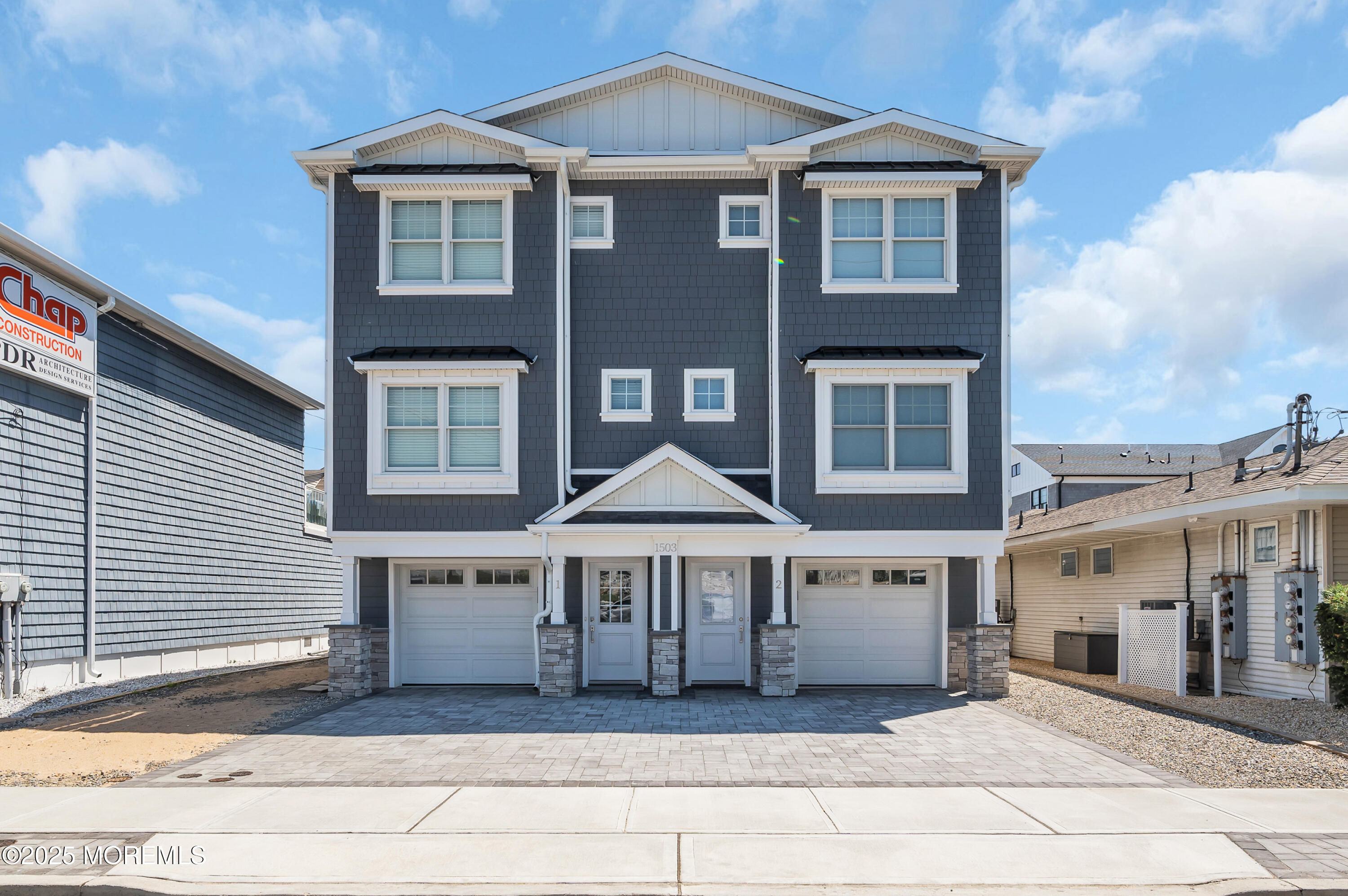 a front view of a building with a garden