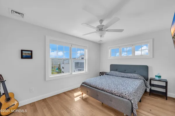 a bedroom with a large bed and a window
