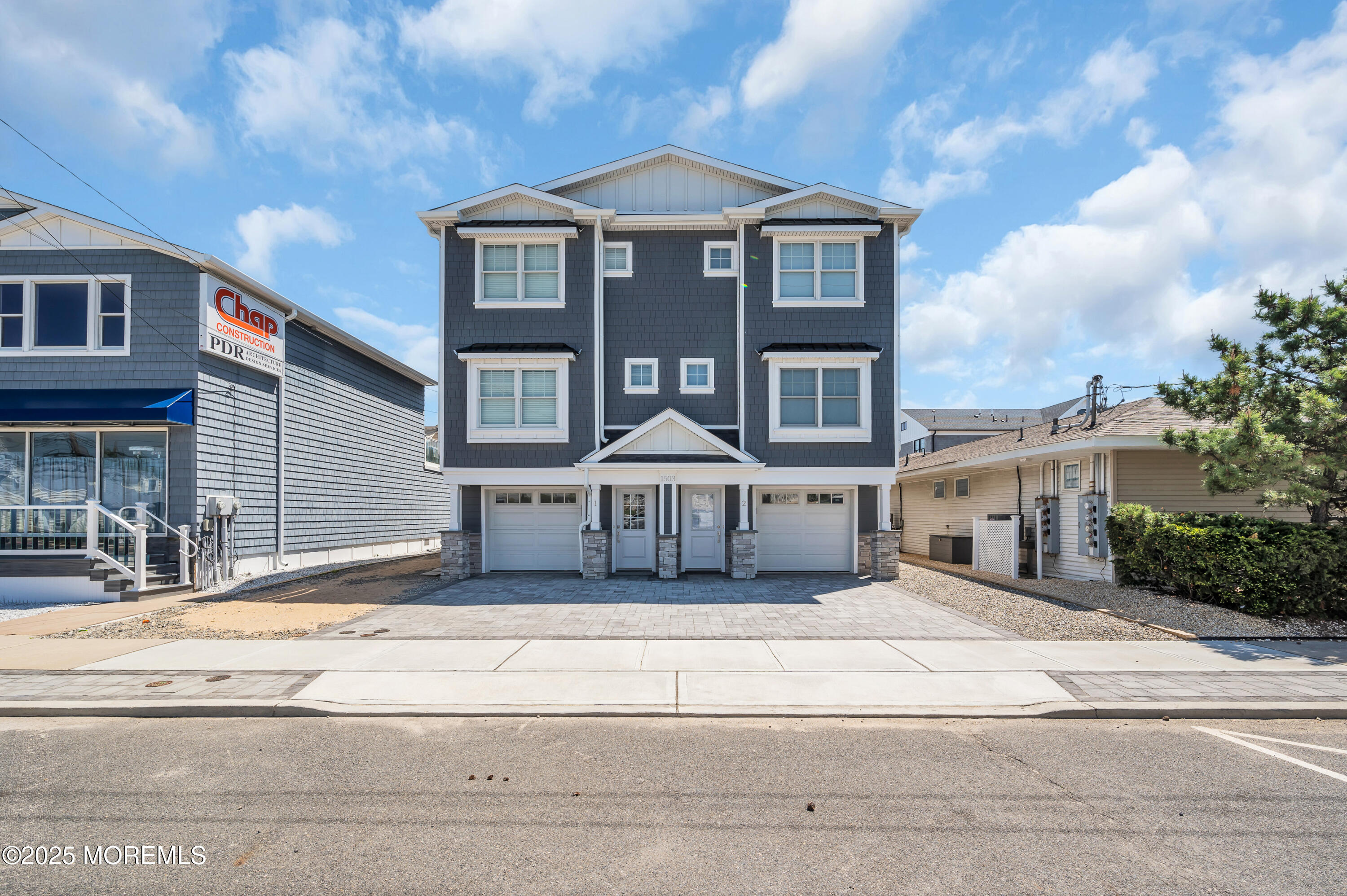 1503 Grand Central Avenue, Unit 2 Lavallette, NJ 08735 - Photo 2 of 47 a front view of a house with a yard