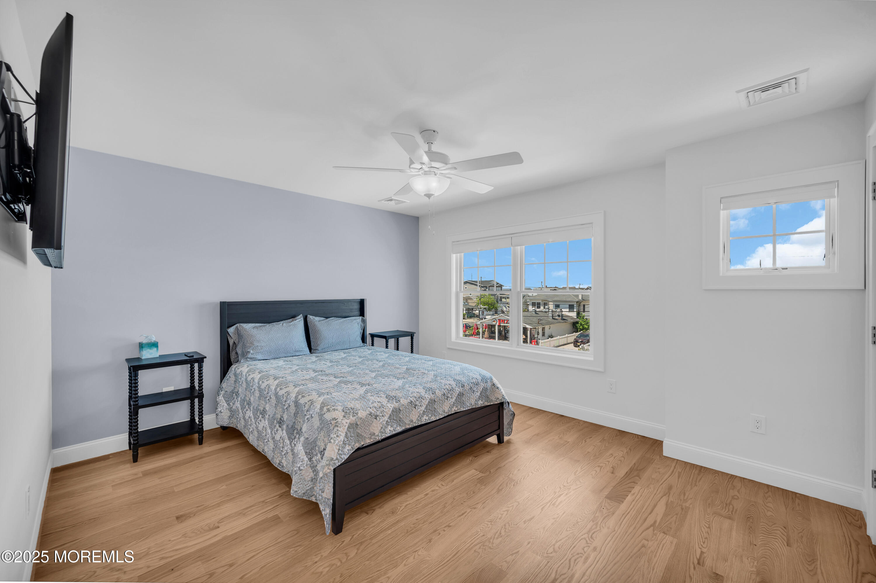 1503 Grand Central Avenue, Unit 2 Lavallette, NJ 08735 - Photo 27 of 47 a spacious bedroom with a bed and a window