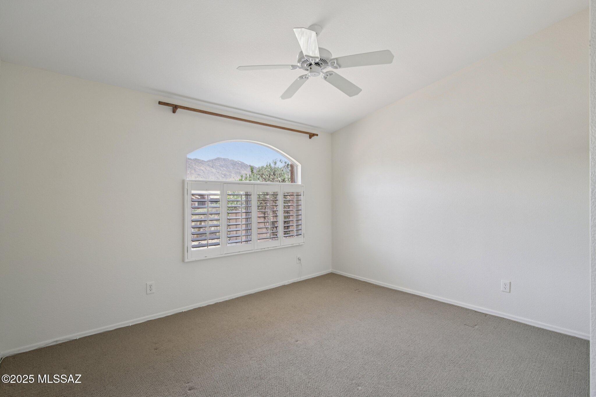 35890 Mesa Ridge Drive Tucson, AZ 85739 - Photo 13 of 31 an empty room with a window