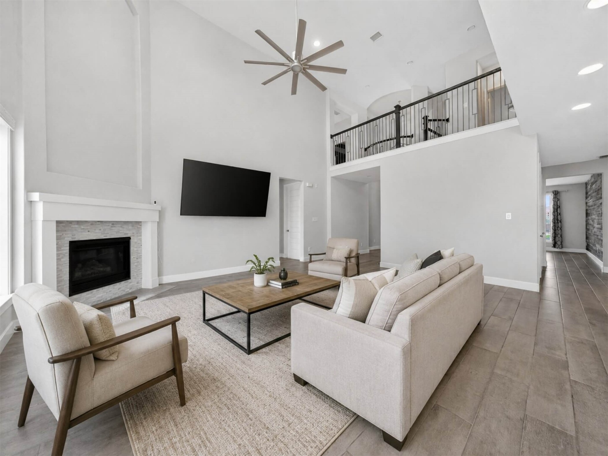 4343 Martin Ridge Drive Manvel, TX 77578 - Photo 14 of 50 a living room with furniture a flat screen tv and a fireplace
