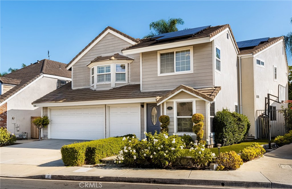11 Porter Irvine, CA 92620 - Photo 1 of 1 a front view of a house with a yard and garage