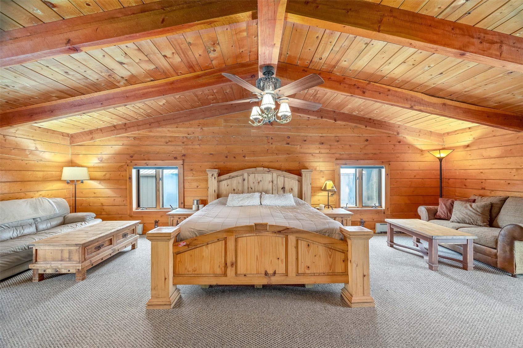 597 Sheep Ridge Road Fairplay, CO 80440 - Photo 20 of 50 a bedroom with furniture and a ceiling fan