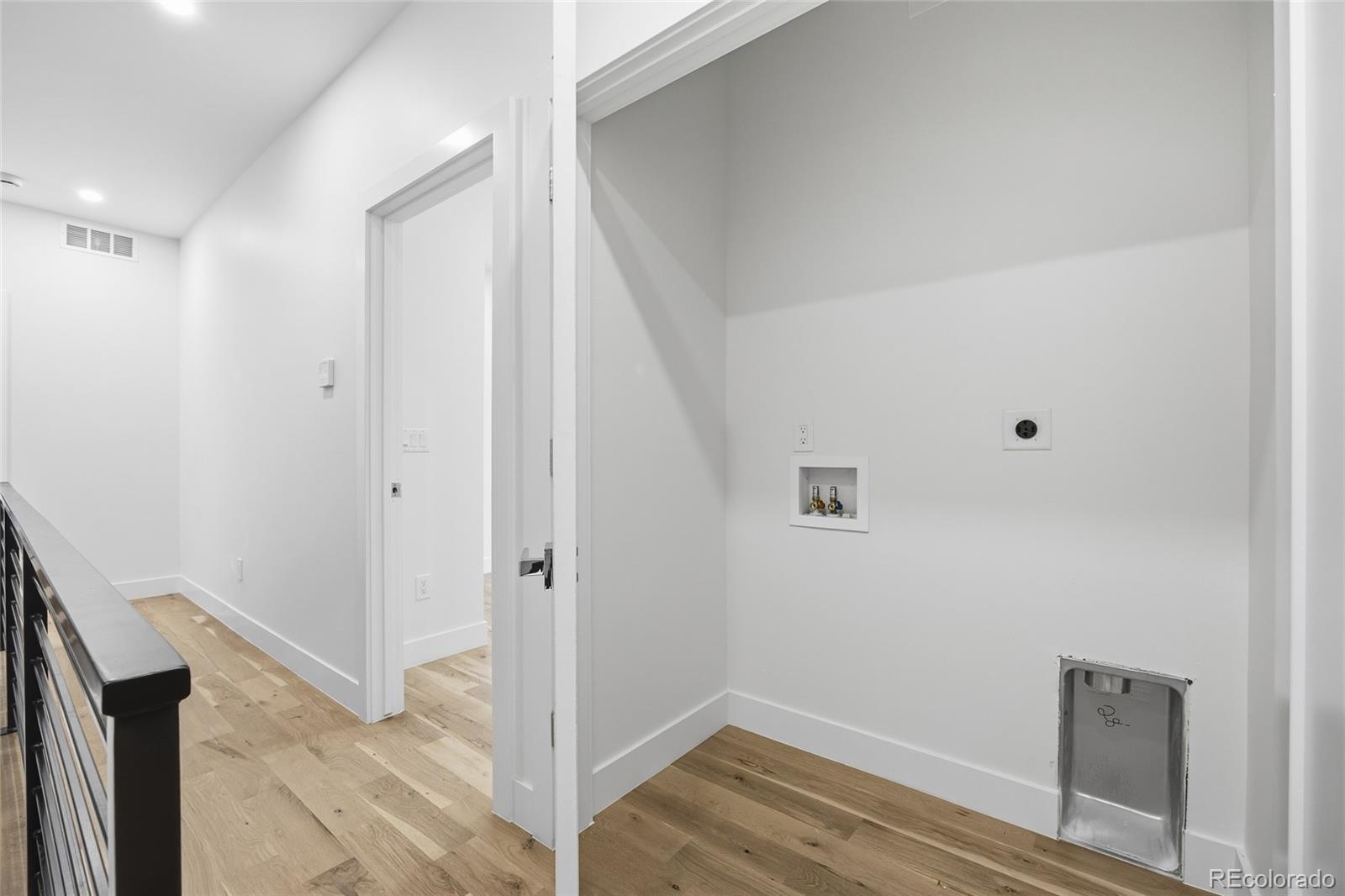 1448 Stuart Street Denver, CO 80204 - Photo 19 of 27 a view of small space with wooden floor