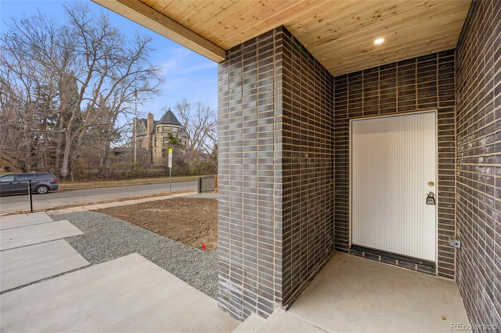 1448 Stuart Street Denver, CO 80204 - Photo 2 of 27 a view of a pathway along the building