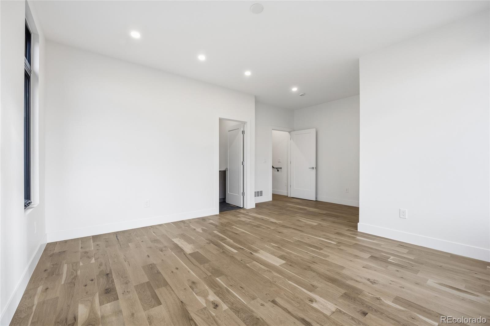 1448 Stuart Street Denver, CO 80204 - Photo 25 of 27 a view of empty room with wooden floor