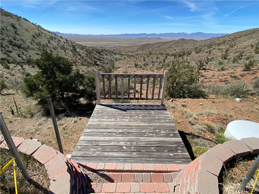 9095 Elliott Ridge Road Kingman, AZ 86401 - Photo 23 of 54 a view of balcony with wooden floor and mountain view