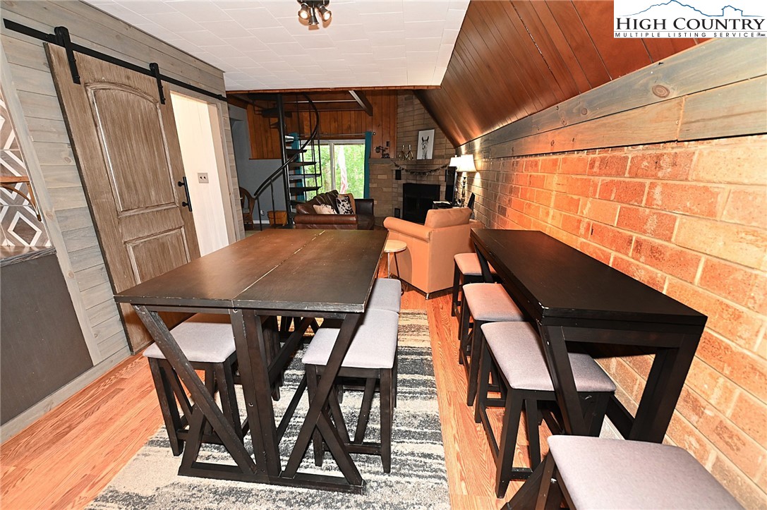 3430-3390 Rose Creek Road Morganton, NC 28655 - Photo 11 of 50 a view of a dining room with furniture and a window