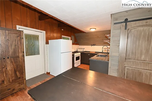 a kitchen with stainless steel appliances a refrigerator and a stove