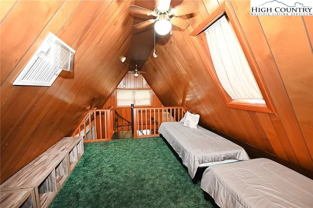 a bedroom with bed and a window