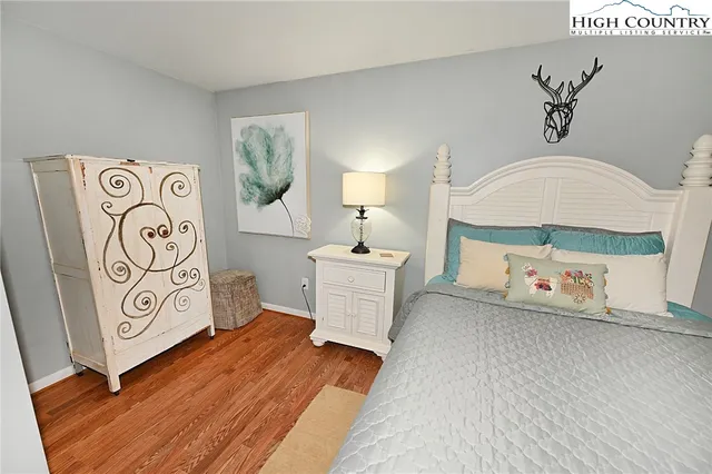 a bed room with a bed and a window