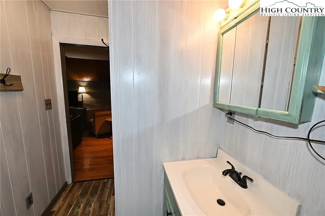 a view of walk in closet with clothes