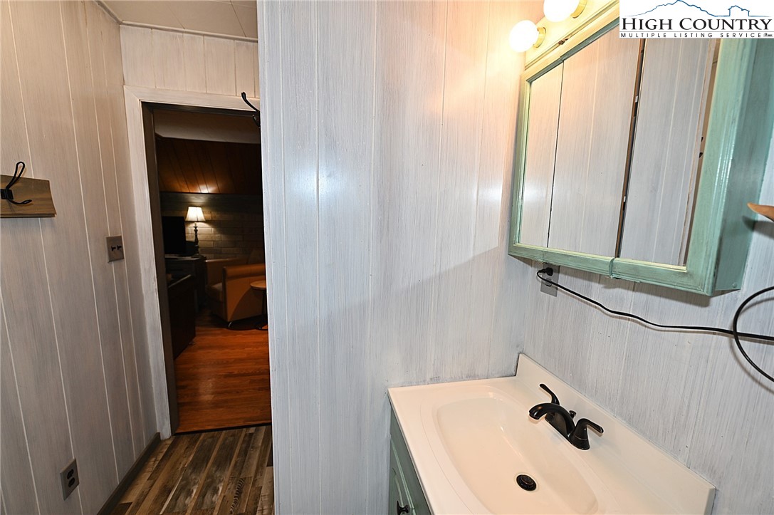 3430-3390 Rose Creek Road Morganton, NC 28655 - Photo 35 of 50 a bathroom with a sink and mirror