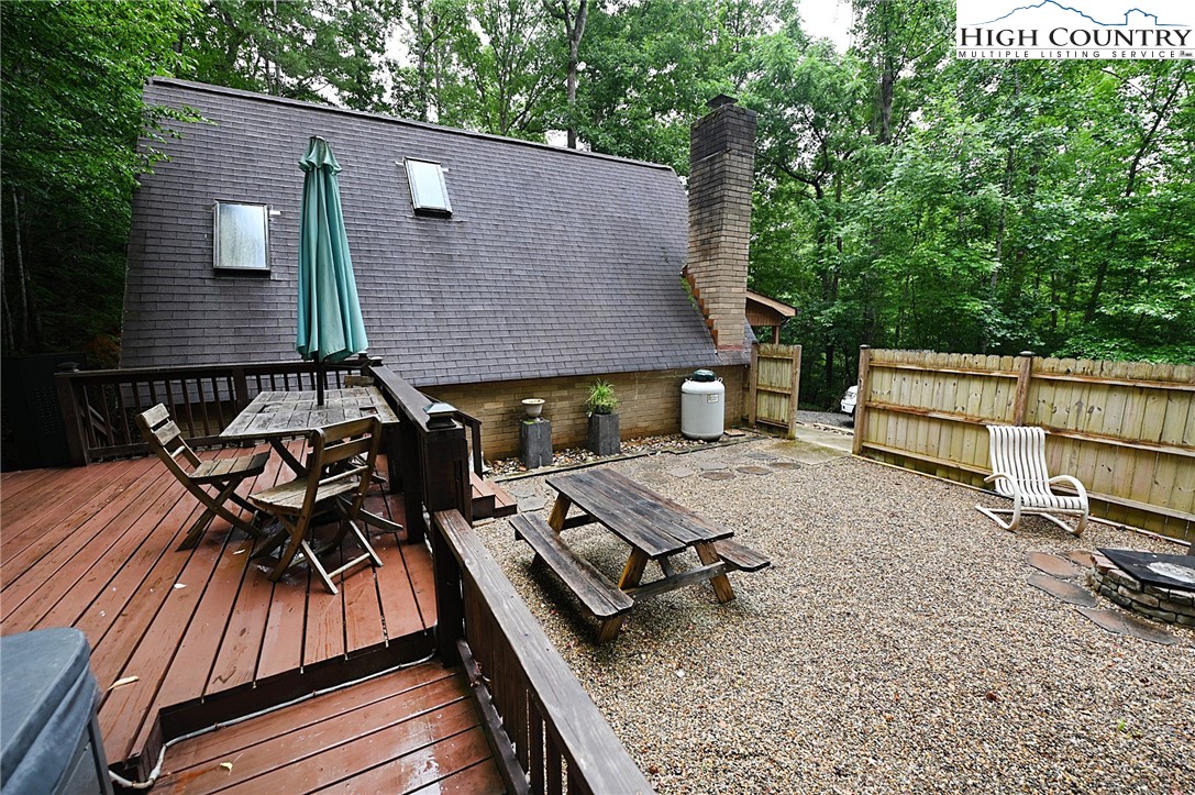 3430-3390 Rose Creek Road Morganton, NC 28655 - Photo 38 of 50 a view of a patio with a table and chairs