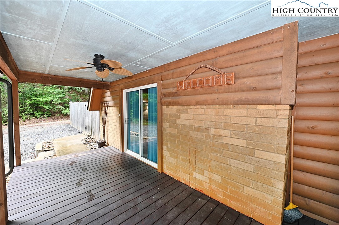 3430-3390 Rose Creek Road Morganton, NC 28655 - Photo 39 of 50 a view of a balcony with wooden floor and iron stairs