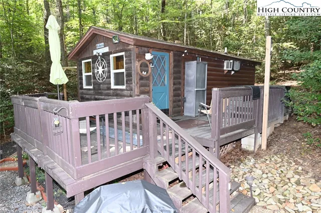 a front view of a house with a bench
