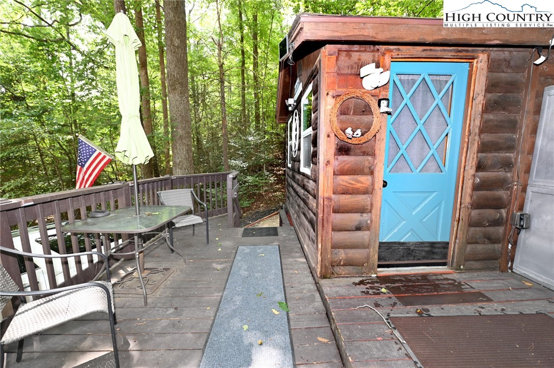 3430-3390 Rose Creek Road Morganton, NC 28655 - Photo 43 of 50 a front view of a house with a bench