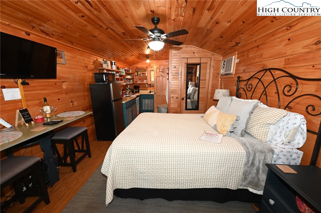 3430-3390 Rose Creek Road Morganton, NC 28655 - Photo 44 of 50 a bed room with a bed and a flat screen tv