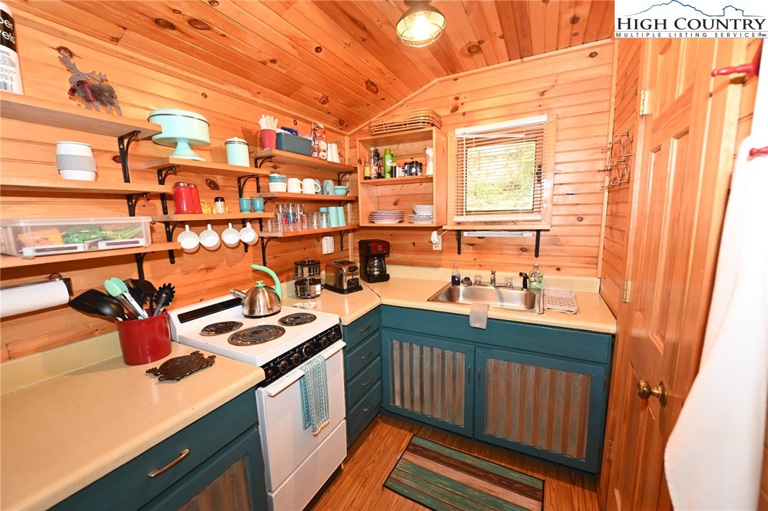 3430-3390 Rose Creek Road Morganton, NC 28655 - Photo 46 of 50 a kitchen that has a sink and a stove